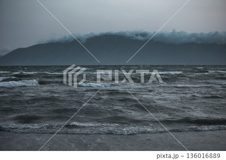 the sea under the mountain on a summer day Vlora, Albania, photographed on August 2025. the sea under the mountain on a summer day Vlora, Albania, photographed on August 2025. 136016889