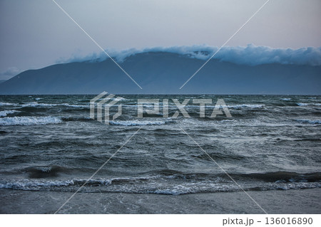the sea under the mountain on a summer day Vlora, Albania, photographed on August 2025. the sea under the mountain on a summer day Vlora, Albania, photographed on August 2025. 136016890
