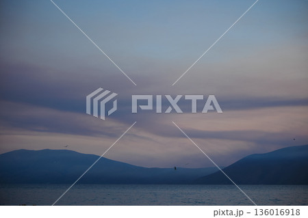 the sea under the mountain on a summer day Vlora, Albania, photographed on August 2025. 136016918