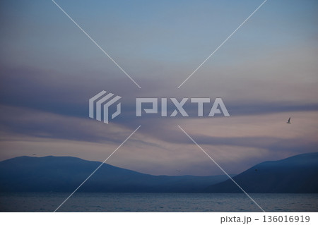 the sea under the mountain on a summer day Vlora, Albania, photographed on August 2025. 136016919