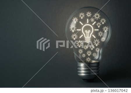 A transparent light bulb with many glowing symbols inside on a dark background. Space for text. 136017042