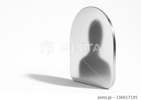 A blurry reflection of a human figure in a metal mirror. Space for text. 136017195