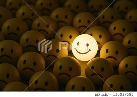 Glowing smiling emoji among sad faces. 136017589