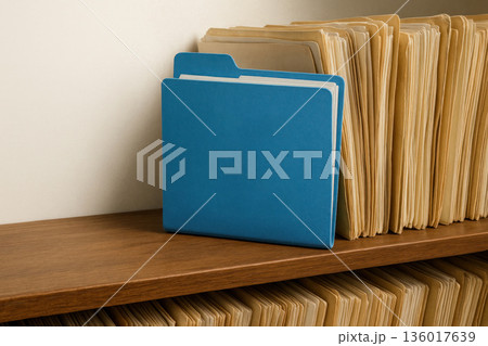 A blue folder among old paper documents. Space for text. A blue folder among old paper documents. Space for text. 136017639