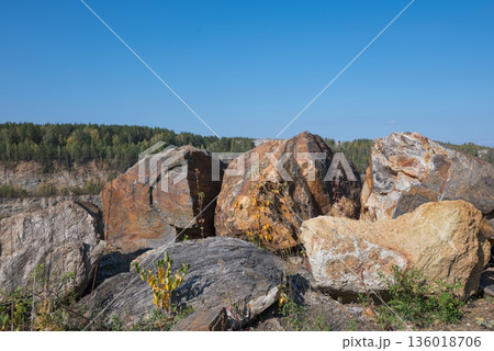 The production of graphite. Industrial background. Stone structure of the mineral. The production of graphite. Industrial background. Stone structure of the mineral. 136018706