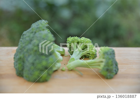fresh cleaning broccoli for making food on cutting board fresh cleaning broccoli for making food on cutting board 136018887
