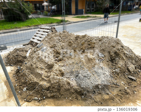 Road construction site with sand and bricks. Repair and maintenance. Process of new road construction 136019306
