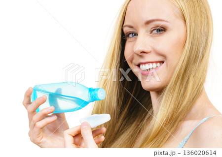 Woman using cleanser cosmetic 136020614