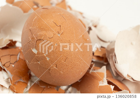 Broken shell texture, macro shot of a hard boiled egg. Broken shell texture, macro shot of a hard boiled egg. 136020858