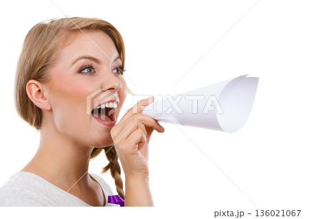 Woman screaming through megaphone made of paper 136021067