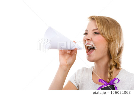 Woman screaming through megaphone made of paper Woman screaming through megaphone made of paper 136021068