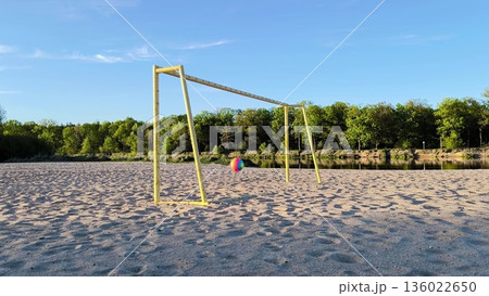 Happy baby boy playing ball on the beach. Fun outdoor activities. kid dreams. 136022650