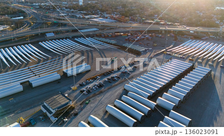 Aerial view of wind turbine blades storage at port logistics hub Aerial view of wind turbine blades storage at port logistics hub 136023091