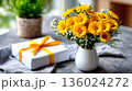 Bright Yellow Flowers and Gift Box: A Cheerful Arrangement for Any Occasion 136024272