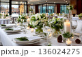 Elegant Wedding Reception Table Setting with White Flowers and Candles 136024275