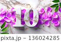 Elegant '10' with Marble Texture, Purple Petals, and Green Leaves on Marble Background 136024285