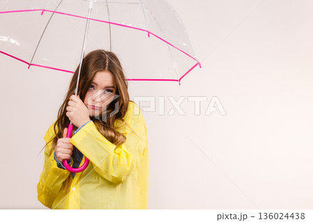 Woman under umbrella looking sad unhappy 136024438