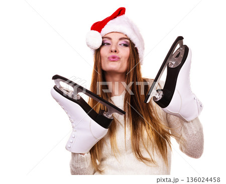 Girl with santa claus cap. 136024458