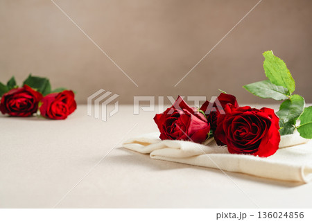 Mother's Day or Valentine's Day background. Red rose flowers on neutral background. Greeting card template, copy space Mother's Day or Valentine's Day background. Red rose flowers on neutral background. Greeting card template, copy space 136024856