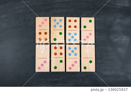 Wooden Domino Tiles Arranged In Grid Pattern On Dark Background Wooden Domino Tiles Arranged In Grid Pattern On Dark Background 136025937