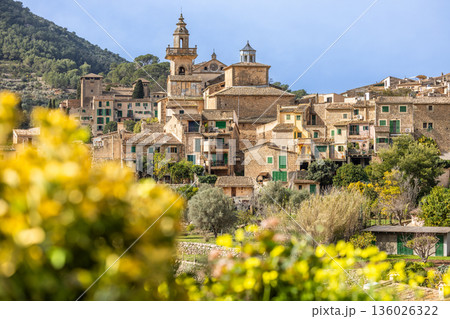 Panoramic view of the mountain village of Valldemossa with church Sant Bartomeu in Serra de Tramuntana mountains, Mallorca, Balearic Islands, Spain Panoramic view of the mountain village of Valldemossa with church Sant Bartomeu in Serra de Tramuntana mountains, Mallorca, Balearic Islands, Spain 136026322