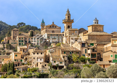 Mountain village of Valldemossa with Royal Charterhouse and church Sant Bartomeu in Serra de Tramuntana mountains, Mallorca, Balearic Islands, Spain Mountain village of Valldemossa with Royal Charterhouse and church Sant Bartomeu in Serra de Tramuntana mountains, Mallorca, Balearic Islands, Spain 136026323