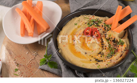 Delicious hummus in ceramic bowl Delicious hummus in ceramic bowl 136027224