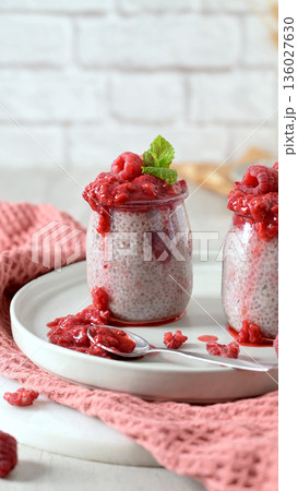Chia seed pudding with fresh raspberry coulis 136027630