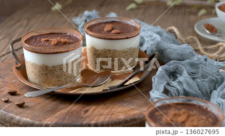Layered Tiramisu Chia Seed Pudding with Cocoa Powder and Coffee Beans Layered Tiramisu Chia Seed Pudding with Cocoa Powder and Coffee Beans 136027695