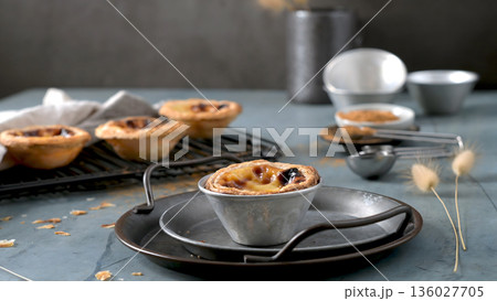 Freshly Baked Pastel de Nata in a Rustic Tin on a Metal Serving Tray 136027705