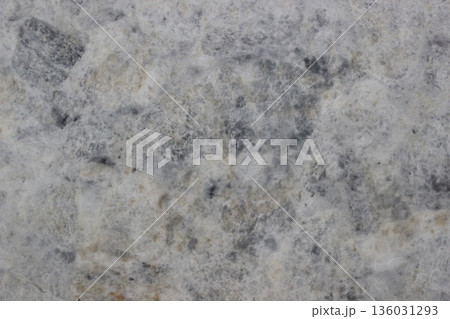 Detail of super white quartzite natural stone texture showing soft grey and white mineral crystal patterns Detail of super white quartzite natural stone texture showing soft grey and white mineral crystal patterns 136031293