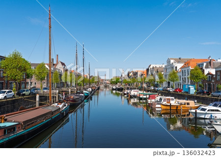 Picturesque Rotterdam Canal Scene with Boats and Historic Buildings in the Netherlands, Europe Picturesque Rotterdam Canal Scene with Boats and Historic Buildings in the Netherlands, Europe 136032423