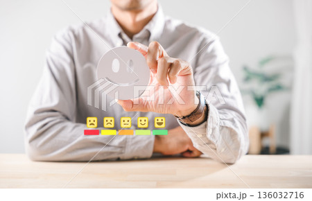 Satisfaction concept, customer feedback showing happy emoji face, business person demonstrating excellent service quality rating, positive online survey experience evaluation Satisfaction concept, customer feedback showing happy emoji face, business person demonstrating excellent service quality rating, positive online survey experience evaluation 136032716
