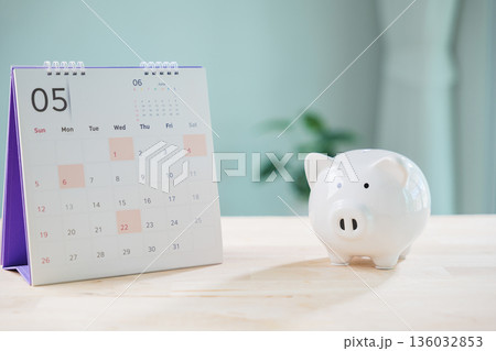 money save plan saving calendar bank piggy financial manage retirement insurance date tax growth, white piggy bank on wooden table for monthly budget and wealth management goals money save plan saving calendar bank piggy financial manage retirement insurance date tax growth, white piggy bank on wooden table for monthly budget and wealth management goals 136032853