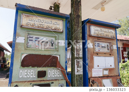 Old abandoned gas stations with inscriptions in Thai and English Diesel and Gasoline at an abandoned gas station on Koh Kho Khao Island in Thailand. High quality photo Old abandoned gas stations with inscriptions in Thai and English Diesel and Gasoline at an abandoned gas station on Koh Kho Khao Island in Thailand. High quality photo 136033323