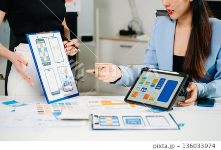 UX graphic designer planning application process development prototype wireframe for web smart phone. Creative digital development agency. UX graphic designer planning application process development prototype wireframe for web smart phone. Creative digital development agency. 136033974