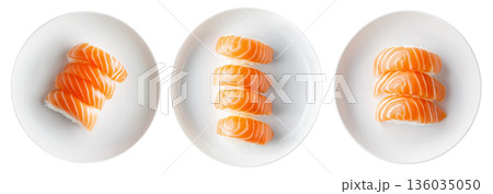 Salmon nigiri sushi arranged neatly on white plate, isolated on white background, concept of Japanese cuisine Salmon nigiri sushi arranged neatly on white plate, isolated on white background, concept of Japanese cuisine 136035050