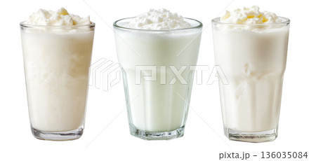 Ayran salted yogurt drink in tall glass with foamy top and mint leaf, isolated on white background, concept of healthy drink Ayran salted yogurt drink in tall glass with foamy top and mint leaf, isolated on white background, concept of healthy drink 136035084