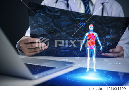 Doctor analyzing medical hologram with human anatomy projection, representing digital healthcare, innovation, telemedicine, AI diagnosis, and future medical technology. Doctor analyzing medical hologram with human anatomy projection, representing digital healthcare, innovation, telemedicine, AI diagnosis, and future medical technology. 136035399