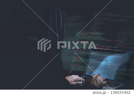 Cybersecurity hacker typing code on laptop in dark room, concept of hacking, malware, identity theft, cyber attack, data protection, and online fraud prevention. Cybersecurity hacker typing code on laptop in dark room, concept of hacking, malware, identity theft, cyber attack, data protection, and online fraud prevention. 136035402