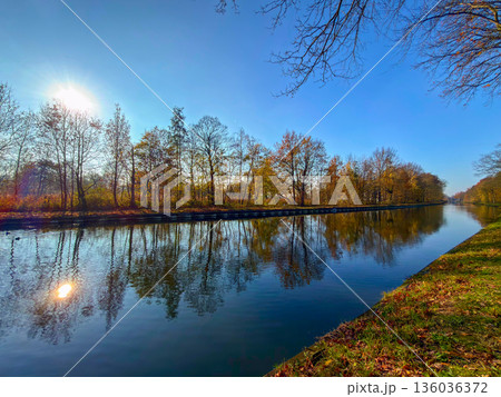 Rijkevorsel, Antwerpse Kempen, Belgium, Peaceful waterway reflecting vibrant fall foliage beneath Rijkevorsel, Antwerpse Kempen, Belgium, Peaceful waterway reflecting vibrant fall foliage beneath 136036372