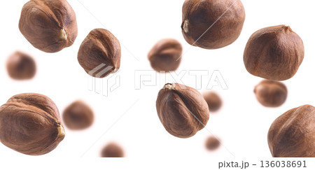 Peeled hazelnut levitates on a white background 136038691