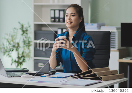Young Asian businesswoman giving presentation Young Asian businesswoman giving presentation 136040892