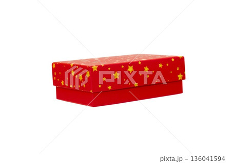 A Red Gift Box with Gold stars is Isolated White Background Cutout 136041594