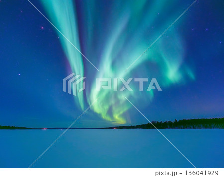 The green northern lights reflect on the ice in Norway, Finland, and Sweden. 136041929
