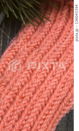 Orange knit fabric texture, suitable for home decor, fashion, or textile crafts. Orange knit fabric texture, suitable for home decor, fashion, or textile crafts. 136043394