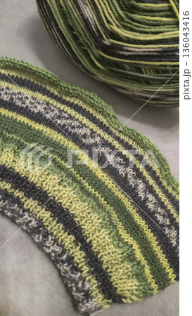 A colorful knitted fabric texture suitable for home decor, fashion, or textile A colorful knitted fabric texture suitable for home decor, fashion, or textile 136043416
