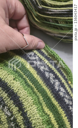 A colorful knitted fabric texture suitable for home decor, fashion, or textile A colorful knitted fabric texture suitable for home decor, fashion, or textile 136043417