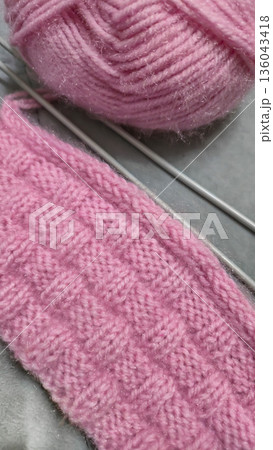 A colorful knitted fabric texture suitable for home decor, fashion, or textile 136043418