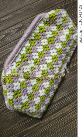 A colorful knitted fabric texture suitable for home decor, fashion, or textile 136043428